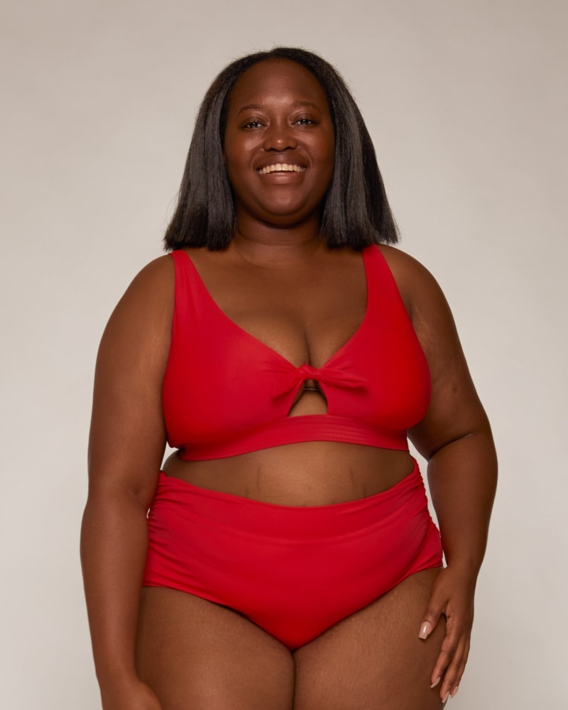 Front of a model wearing a size 10|12 Stella Ruched High-Waist Bottoms in Lava by Wild Isles Swim. | dia_product_style_image_id:284928